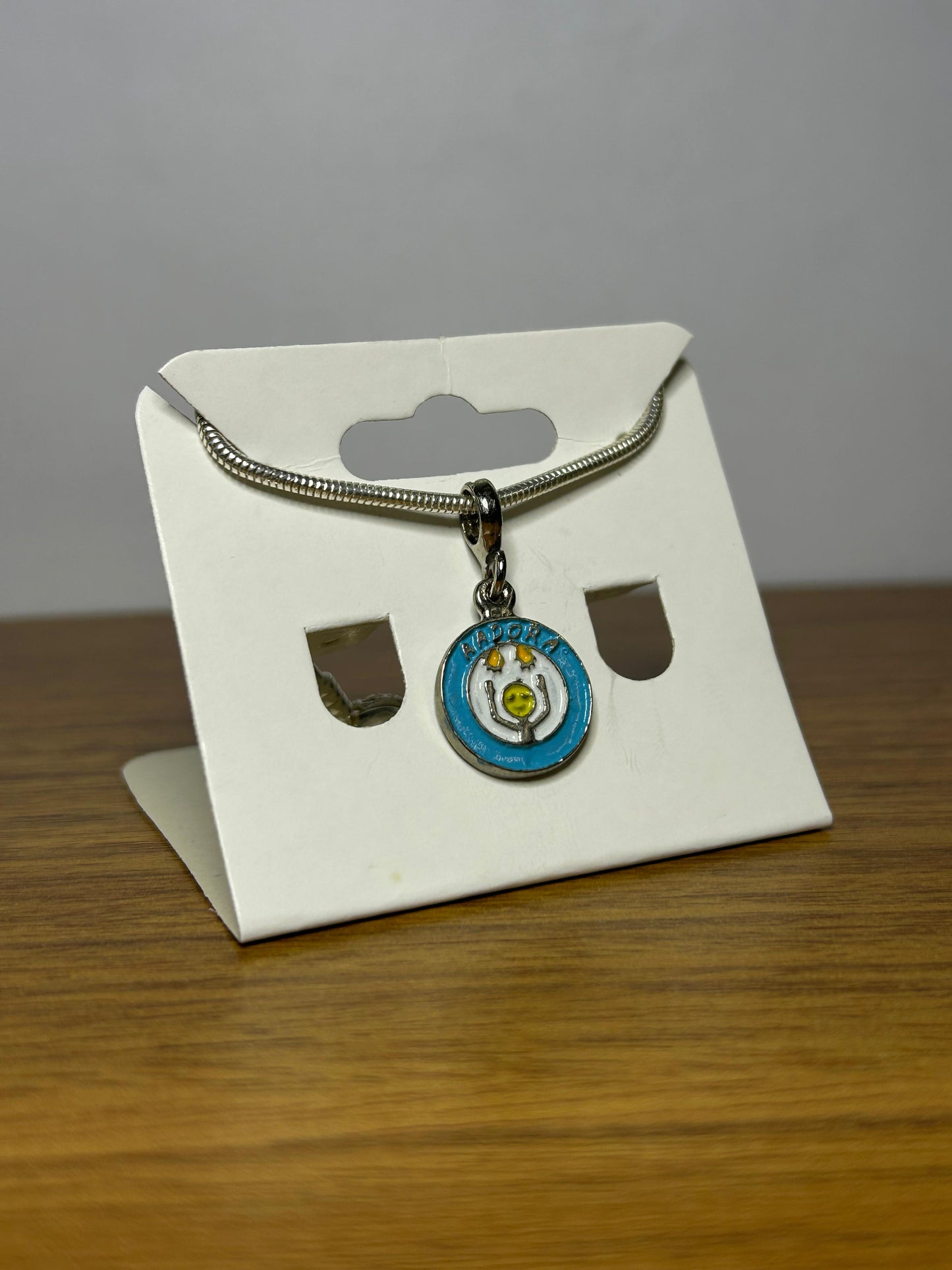 Berloque Símbolo da Aadora - Apoio às Pessoas com Doenças Raras