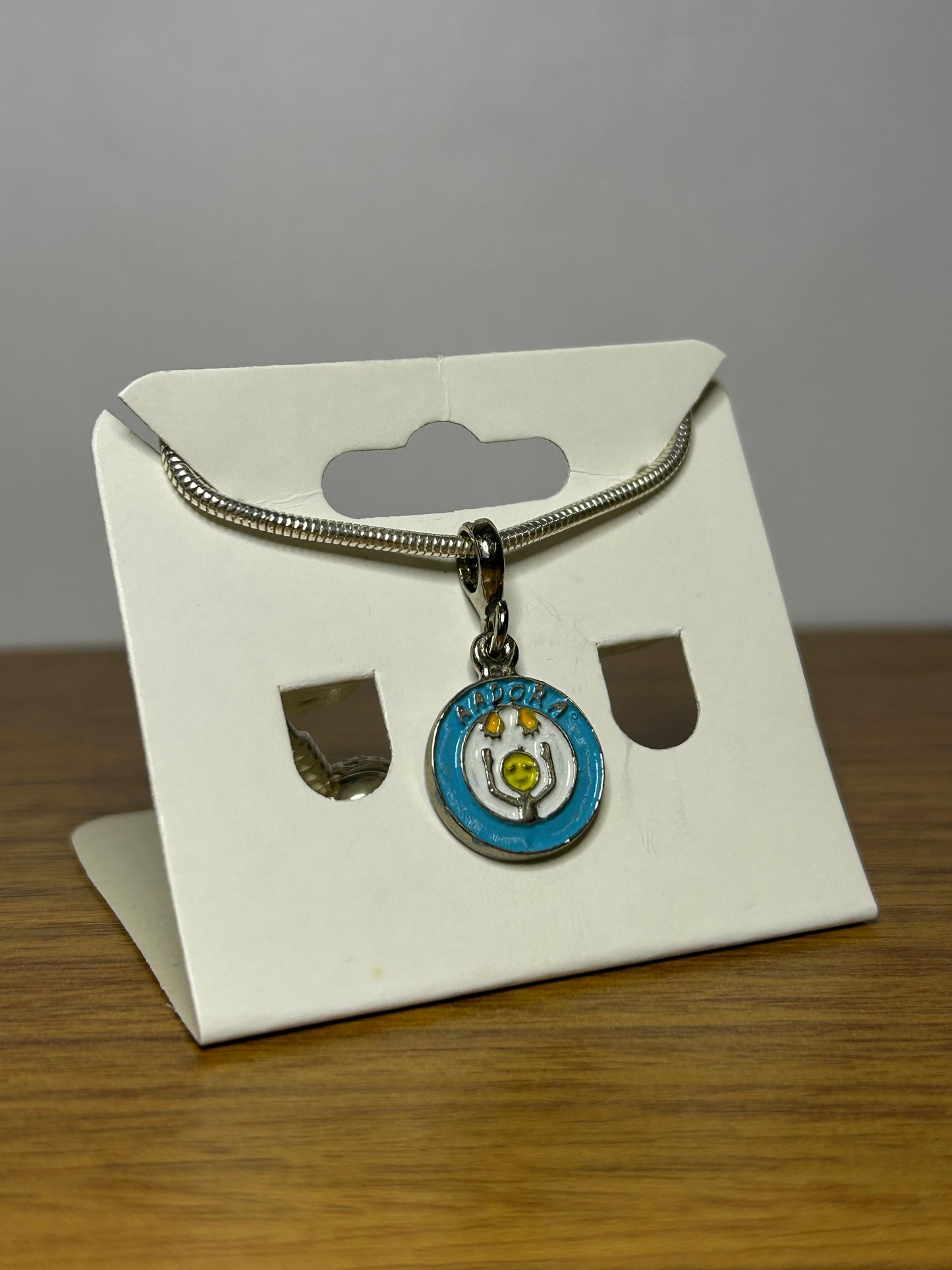 Berloque Símbolo da Aadora - Apoio às Pessoas com Doenças Raras