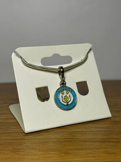 Berloque Símbolo da Aadora - Apoio às Pessoas com Doenças Raras